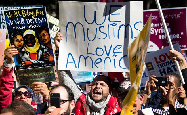 This file photo taken on October 18, 2017 shows demonstrators chanting during a #NoMuslimBanEver rally and march "to protest discriminatory policies that unlawfully target and hurt American Muslim and immigrant communities across the country" in Washington, DC. (AFP / JIM WATSON)
