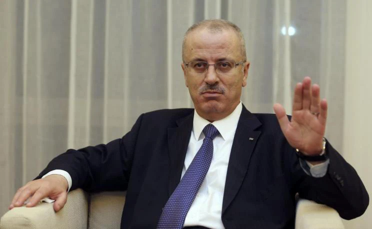 In this file photo, Palestinian Prime Minister Rami Hamdallah speaks with Reuters on November 27, 2013. (REUTERS)