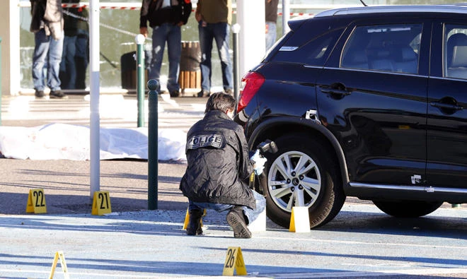 Forensic police work at the scene of a deadly shooting near the body of Antoine Quilichini, aka Tony le boucher (Tony the butcher), who is on police record for organised crime, outside the airport of Bastia, on the French Mediterranean island of Corsica, on Tuesday, December 5, 2017. (AFP)