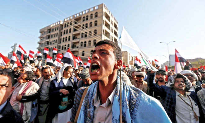 Houthi followers rally in Sanaa on Tuesday. (Reuters)