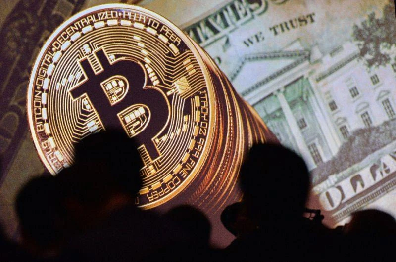 Bitcoin — which came into being in 2009 as a bit of encrypted software and has no central bank backing it — has risen from a 2017 low of $752 in mid-January, and has surged dramatically in the past month. (AFP)