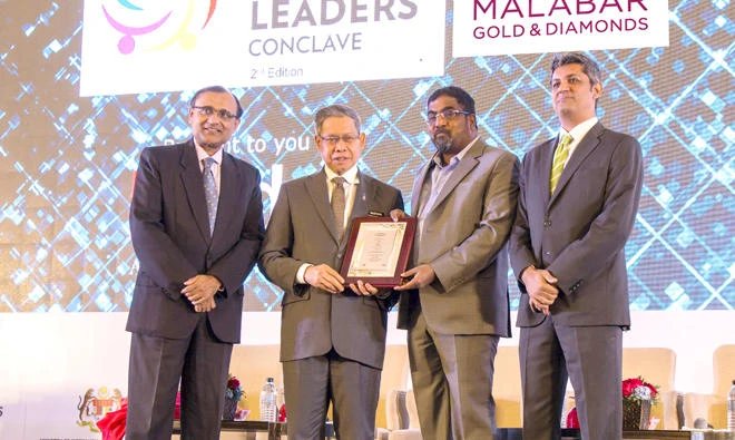 M.P. Ahammed, chairman of Malabar Group, receives the award from Mustapa Mohammed, minister of industrial and international trade, Malaysia.