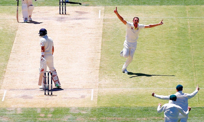 Australia’s Josh Hazlewood celebrates after taking the key wicket of England’s captain Joe Root during the fifth day of the second Ashes Test match. (Reuters)