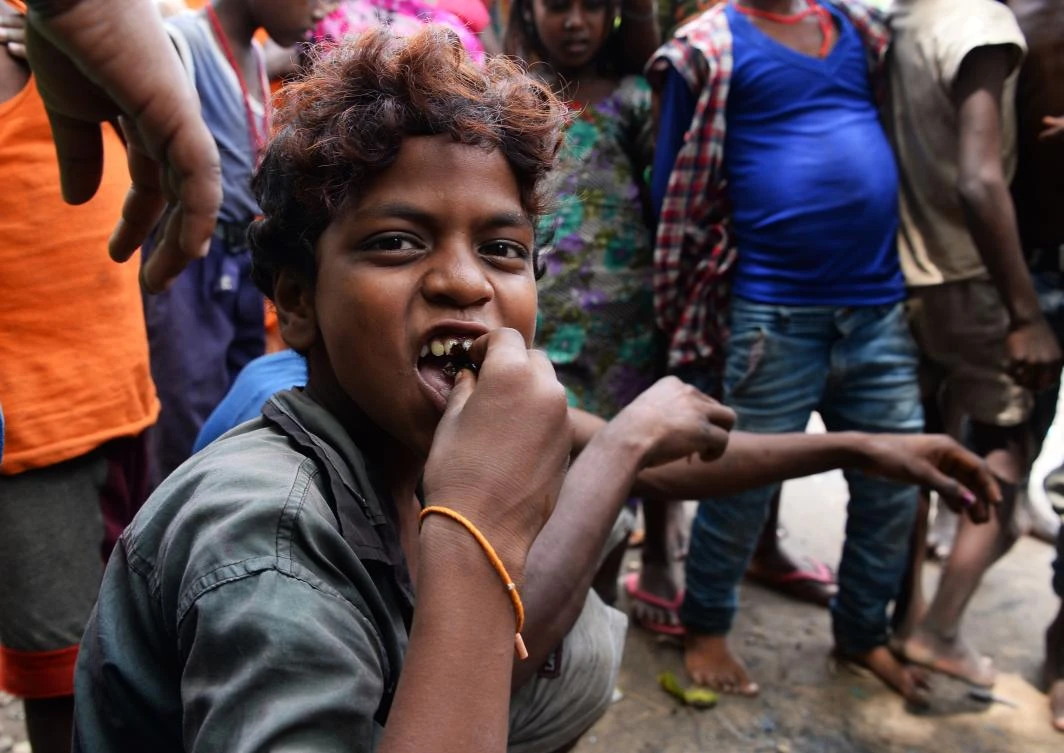 Above, a boy of the Musahar community eats roasted rat at Alampur Gonpura village in the eastern Indian state of Bihar. Musahars are India’s are the poorest among the poorest that even the browbeaten low-caste Dalits look down on them. (AFP)