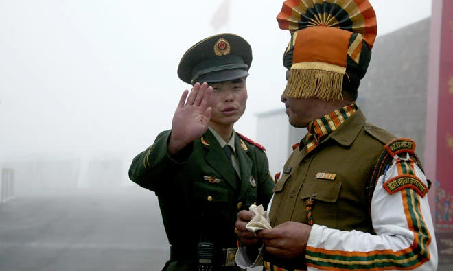 File: A Chinese soldier (L) next to an Indian soldier at the Nathu La border crossing between India and China in India's northeastern Sikkim state. China said, Indian drone had invaded its airspace before crashing, months after the two sides ended a tense border standoff. (AFP)