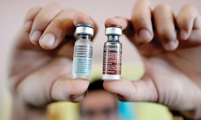This file photo taken on April 4, 2016 shows a nurse showing vials of the anti-dengue vaccine Dengvaxia, developed by French medical giant Sanofi, during a vaccination program at an elementary school in suburban Manila. (AFP)