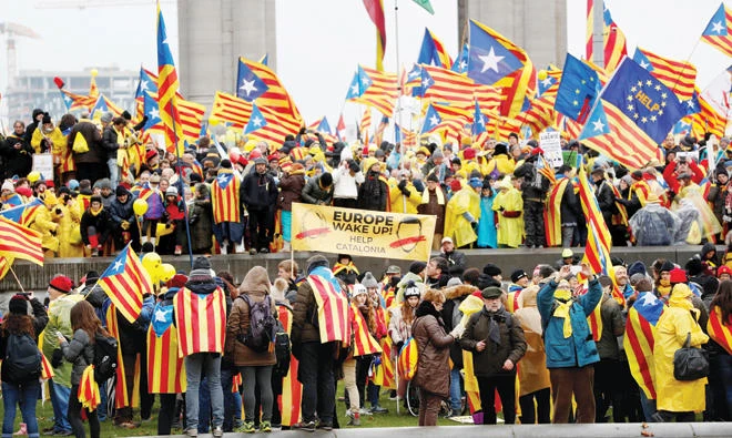 Pro-independence Catalans from all over Europe take part in a rally showing their support to ousted Catalan leader Carles Puigdemont and his government in Brussels on Thursday. (Reuters)
