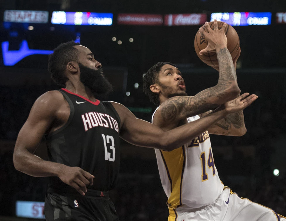 Los Angeles Lakers forward Brandon Ingram (14) goes up for a basket as Houston Rockets guard James Harden (13) defends him during the second half of an NBA basketball game Sunday, Dec. 3, 2017, in Los Angeles. (AP Photo/Kyusung Gong)