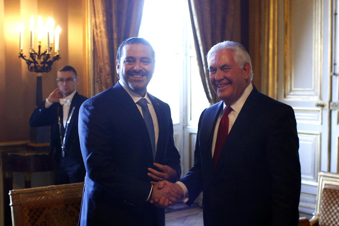 Lebanon’s Prime Minister Saad Hariri, left, shakes hands with US Secretary of State Rex Tillerson at the gathering of world diplomats in Paris on Friday, December 8. (AP)