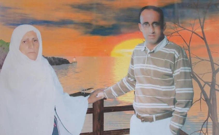 Kamal Al-Assar with his mother, Tamam, in this file photo from the family album.