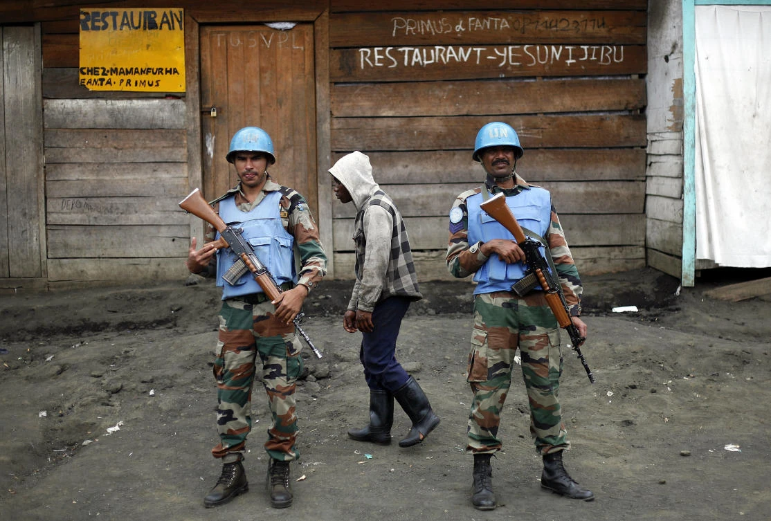 Two UN soldiers stand guard in Goma, Democratic Republic of Congo. (AP)