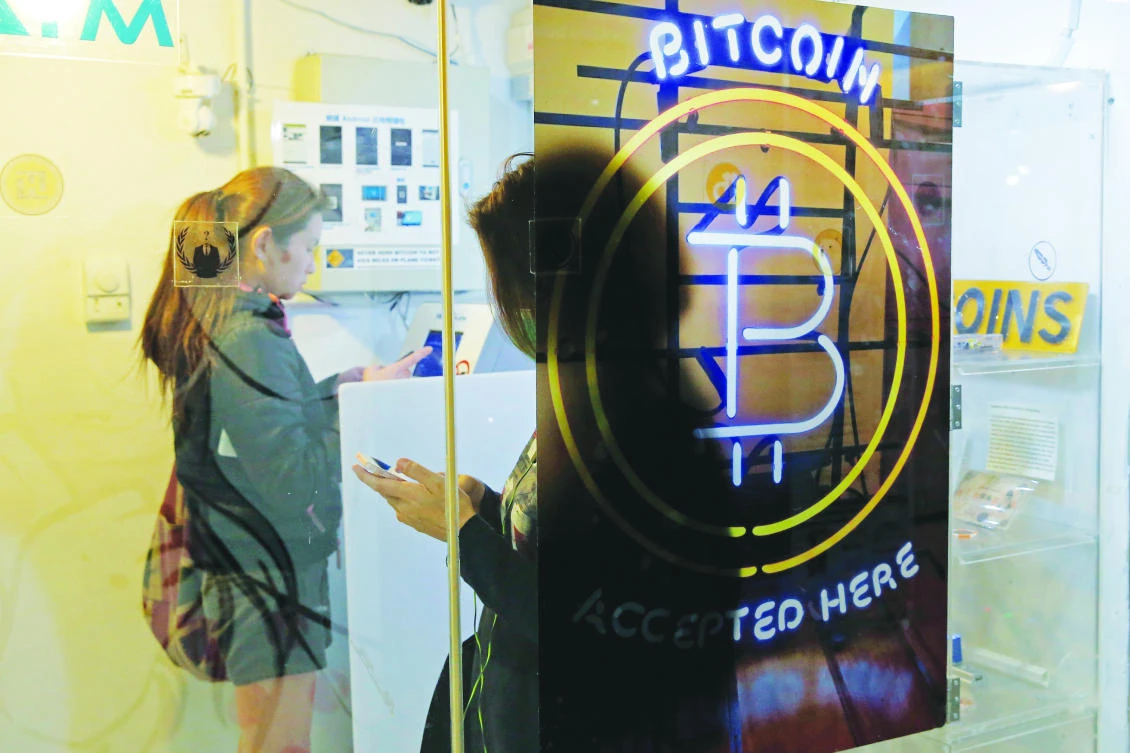 The rise in value of bitcoin has drawn in millions of new investors. (AP)