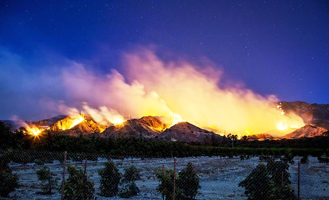 The Thomas Fire burns along a hillside near Santa Paula, California, in this December 5, 2017 photo. (AFP)
