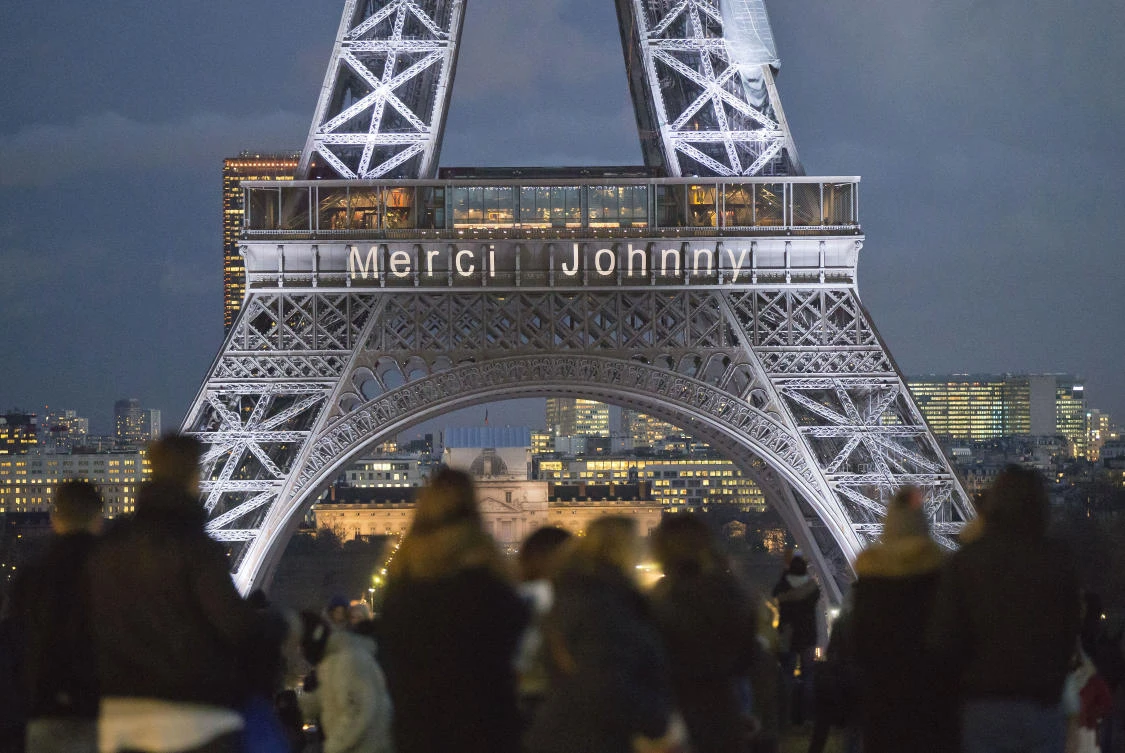 The words “Thank you Johnny” in French is displayed on the Eiffel Tower referring to late French rock star Johnny Hallyday in Paris. (AP)