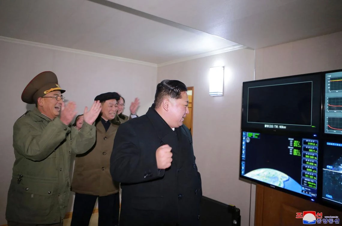 This photo taken on November 29, 2017 and released on November 30, 2017 by North Korea's official Korean Central News Agency (KCNA) shows North Korean leader Kim Jong-Un looking at launching of the Hwasong-15 missile which is capable of reaching all parts of the US. (AFP PHOTO/KCNA VIA KNS)