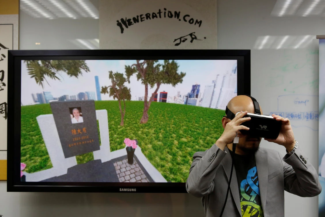 Anthony Yuen, CEO of iVeneration.com, demonstrates an augmented reality graveyard at his office in Hong Kong, China, November 13, 2017. (REUTERS)