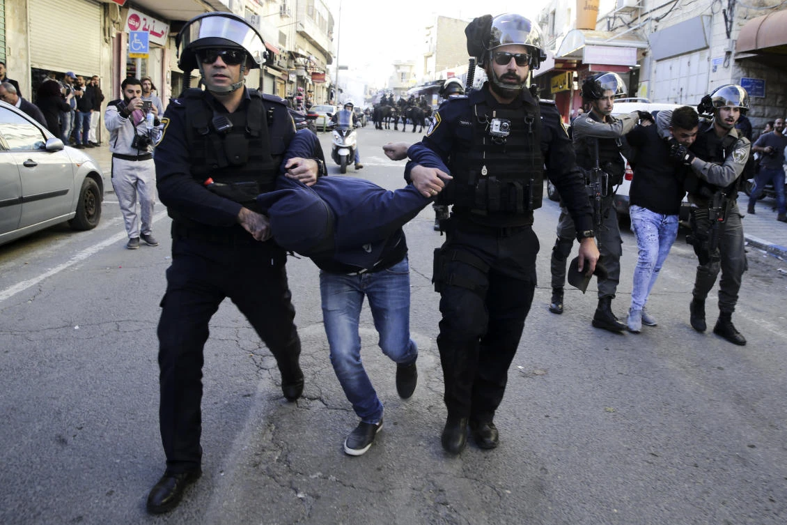 Israeli police arrest Palestinians during a protest against US President Donald Trump's decision to recognize Jerusalem as the capital of Israel in Jerusalem. (AP)