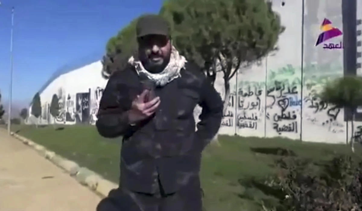 Iraqi militant commander Qais Khazali speaks in front of a wall that was built by Israel at the Fatima Gate border point in the southern village of Kfar Kila, Lebanon. (AP)