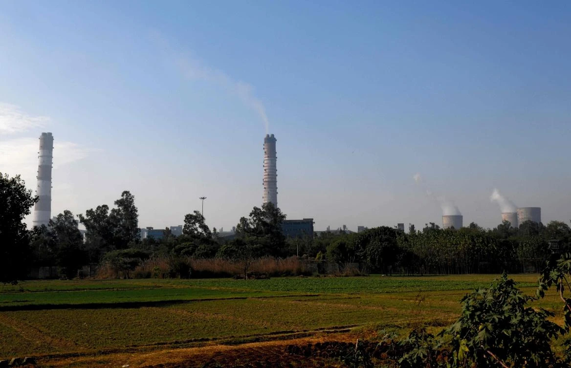 Above, the National Thermal Power Corporation coal plant in Dadri as seen from Uncha Amipur village. The Dadri power plant provides up to one-third of the electricity required for New Delhi, but also fuels the smog that envelops the Indian capital each winter. (AFP)