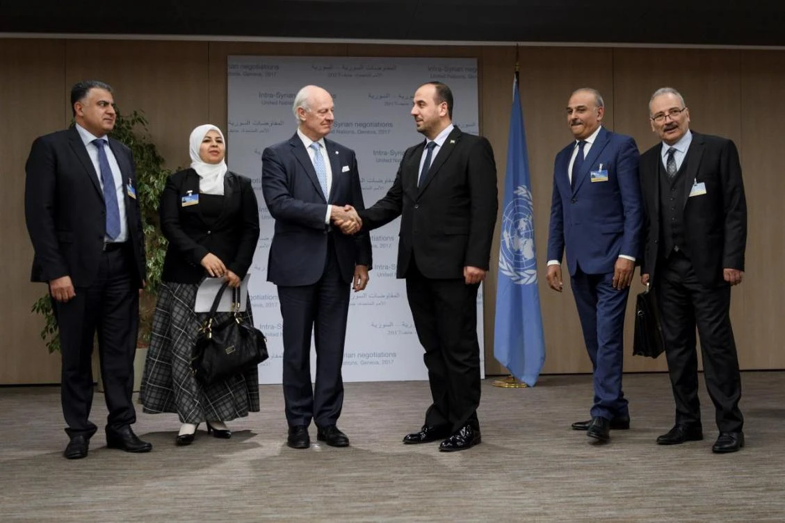 UN mediator Staffan de Mistura, third left, shakes hands with head of the Syrian Negotiation Commission Nasr Al-Hariri, third right, and opposition delegation members (from left) Khaled Al-Mahamid, Hanadi Abu Arab, Jamal Suliman and Safwan Akash, on the opening of a new round of Syria’s talks in Geneva on November 28. (Reuters)
