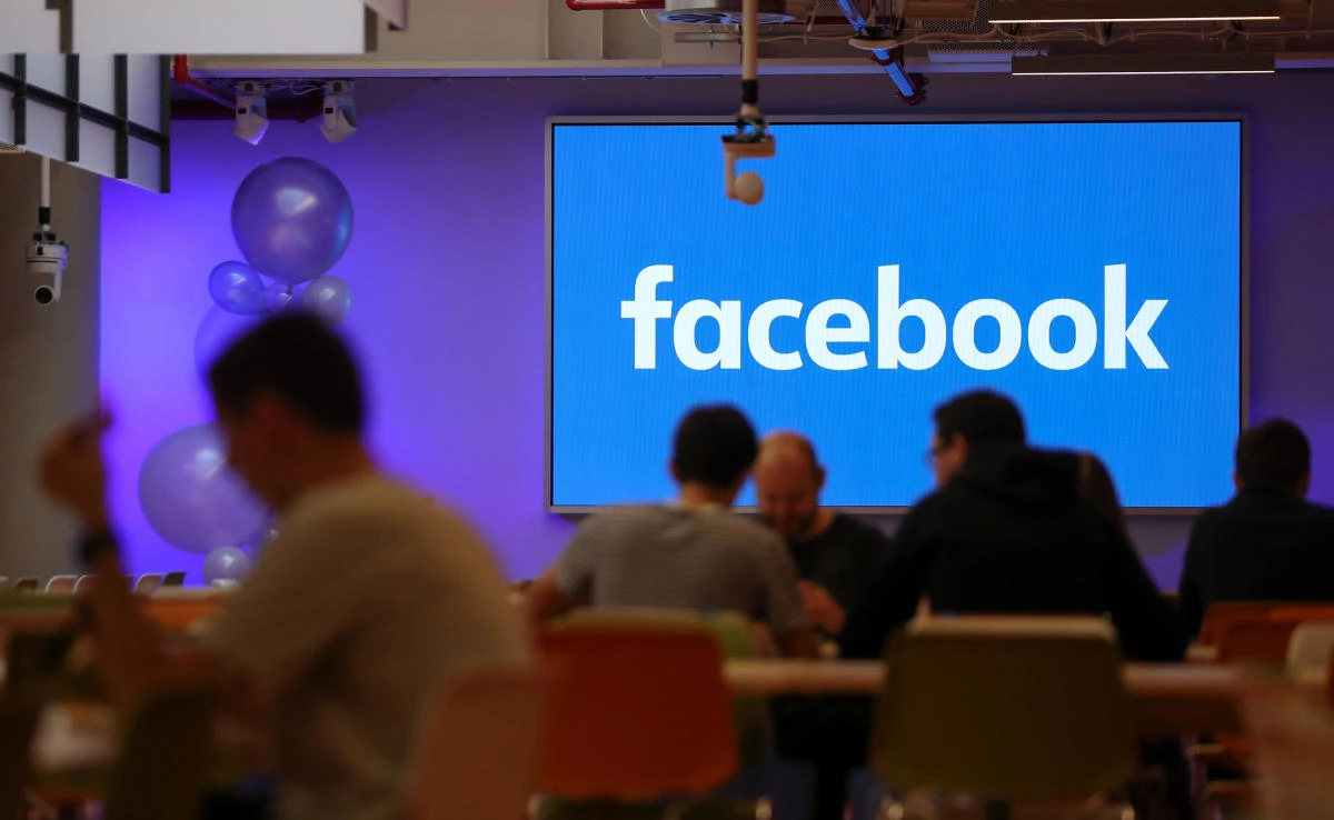 Employees have lunch at the canteen at Facebook’s new headquarters in central London on December 4, 2017. (AFP)