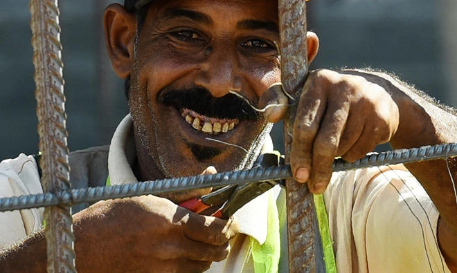 A laborer work at a construction site in Egypt’s new administrative capital, located 45 km east of Cairo. (AFP)