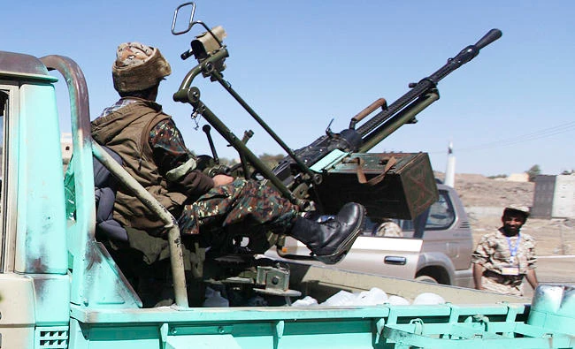 Shi'ite Houthi rebel fighters ride a truck in Sanaa, in this file photo. (REUTERS)