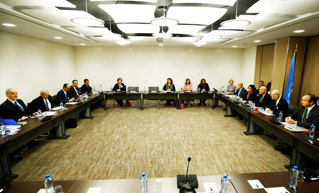 United Nations Special Envoy for Syria Staffan de Mistura (2R) sits opposite to Syria's U.N. ambassador and chief negotiator Bashar al-Ja'afari during a meeting of the Intra Syria talks in Geneva, Switzerland, in this December 1, 2017 photo. (REUTERS)