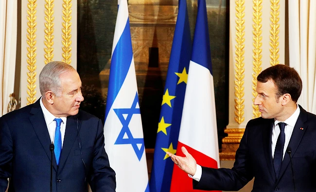 French President Emmanuel Macron and Israeli Prime Minister Benjamin Netanyahu attend a joint news conference at the Elysee Palace in Paris, France on Sunday. (REUTERS)
