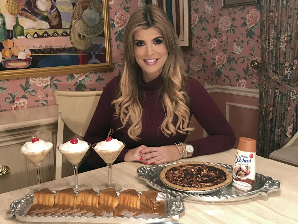 In this 2017 photo provided by Beba Rodriguez, Beba’s mother, Ana Quincoces, sits at a friend’s dining room table in Ft. Lauderdale, Florida Quincoces, a Miami-based attorney and entrepreneur who owns her own food line, says her business and its success involves working mostly with men, and sales and other activities are often concluded over lunch or drinks. Those opportunities, she says, are dwindling, because many of the men she knows through her business “are terrified.” Some men see a simple strategy for stemming sexual harassment at work: Just avoid one-on-one interactions with women. (Beba Rodriguez via AP)