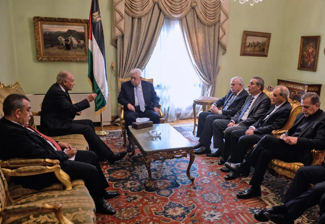 Arab League Secretary General Ahmed Aboul Gheit (2L) meets with Palestinian president Mahmud Abbas (3L) in the presence of Palestinian Foreign Minister Riyad al-Malki (4R) and other Palestinian officials in Cairo on December 11, 2017. (AFP)