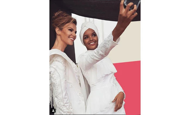 Models Tulin Sahin and Halima Aden at the Dubai Modest Fashion Week. (Via Instagram)
