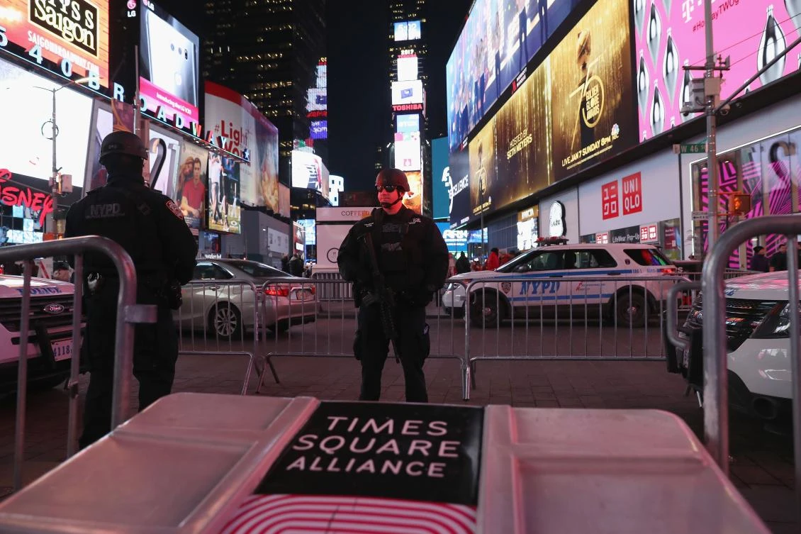 A policeman stands guard in Times Square not far from the site of a pipe bomb explosion on December 11, 2017 in New York City. (AFP)
