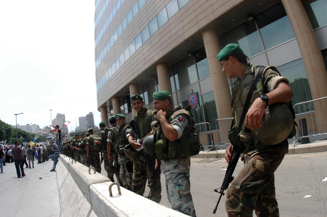 Soldiers stands guard in a check point in Beirut on July 30, 2006. (Shutterstock)