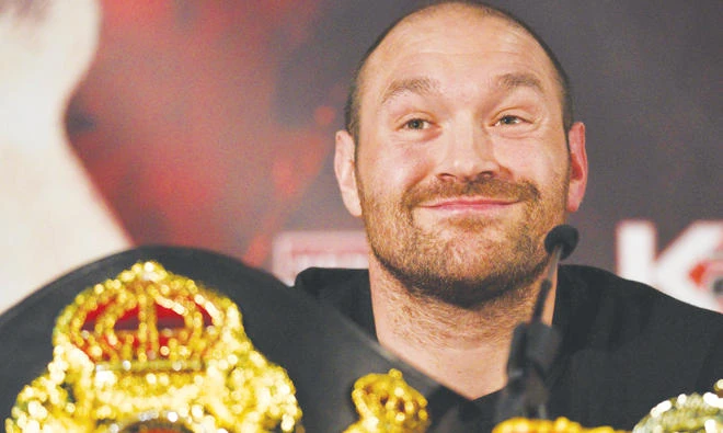 Tyson Fury is all smiles after it was confirmed he is free to resume his boxing career. (AFP)