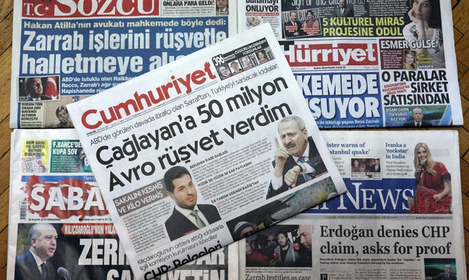 Front pages of some of Turkish newspapers with headlines concerning a trial in New York against a Turkish banker charged with violating US sanctions against Iran, in Ankara, Turkey, on Nov.30, 2017. (AP)