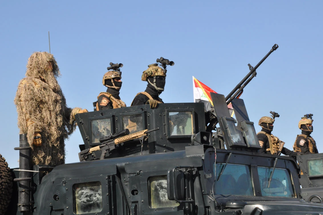 Above, Iraqi federal police members during a military parade in Baghdad’s fortified Green Zone last week. Iraqi Prime Minister Haider Abadi on Saturday declared the end of military operations against Daesh and the liberation of all Iraqi territory formerly held by it. (Reuters)