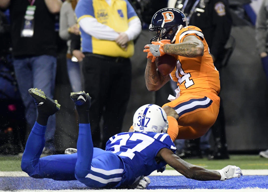 Indianapolis, IN, USA; Denver Broncos receiver Cody Latimer (14) scores a touchdown in the third quarter against the Indianapolis Colts at Lucas Oil Stadium. (Thomas J. Russo-USA Today Sports)