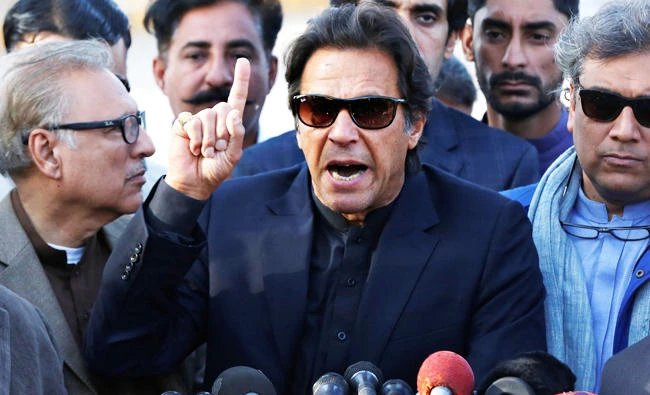 Imran Khan, chairman of the Pakistan Tehreek-e-Insaf (PTI) political party, gestures as he addresses members of the media, after Pakistan's Supreme Court dismissed a petition to disqualify him from parliament for not declaring assets, outside Jinnah International Airport in Karachi, Pakistan December 15, 2017. REUTERS/Akhtar Soomro