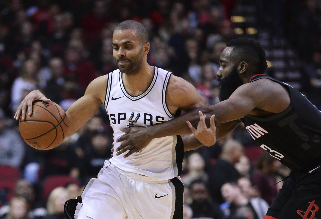 Houston Rockets James Harden, left, fouls San Antonio Spurs Tony Parker to stop a fast break in the second half of their NBA basketball game. The Rockets beat the Spurs for just the third time in their last 12 meetings. (AP)
