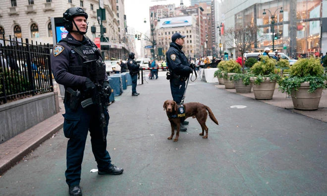 New York police department officers patrol the area around Herald Square on Dec. 12, 2017 in New York. The US unveiled federal terrorism charges against the Bangladeshi driver who detonated a bomb in a New York subway passageway, after allegedly being inspired by the Daesh group. (AFP)