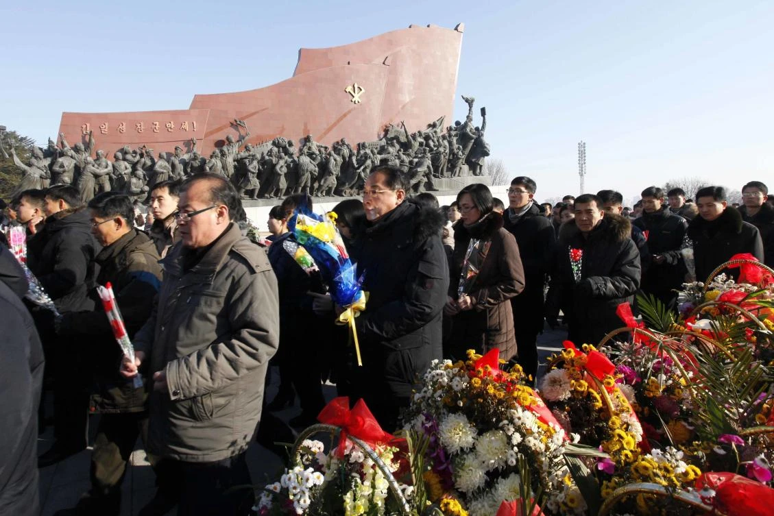 People offer flowers to the bronze statues of their late leaders Kim Il Sung and Kim Jong Il at Mansu Hill, marking the sixth anniversary of leader Kim Jong Il’s death in Pyongyang, Sunday, Dec. 17, 2017. (AP)