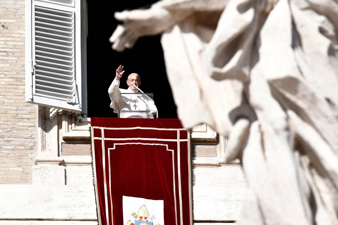 Pope Francis addresses the crowd from the window of the apostolic palace overlooking St. Peter’s square as he celebrates his birthday on December 17. (AFP)