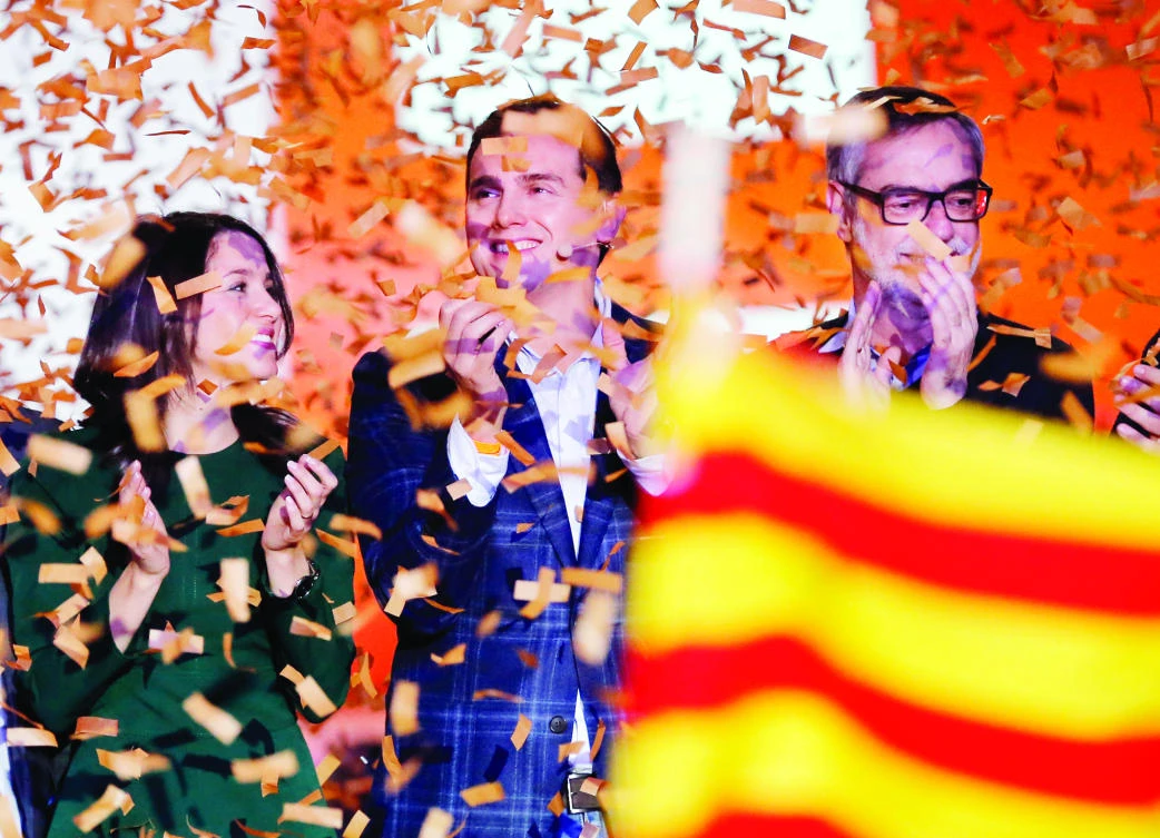 Ines Arrimadas, center-right party Ciudadanos (Citizens) candidate for the upcoming Catalan regional election, left, leader of Ciudadanos, Albert Rivera, center, and Jose Manuel Villegas attend a campaign meeting in L'Hospitalet del Llobregat on Sunday. (AFP)
