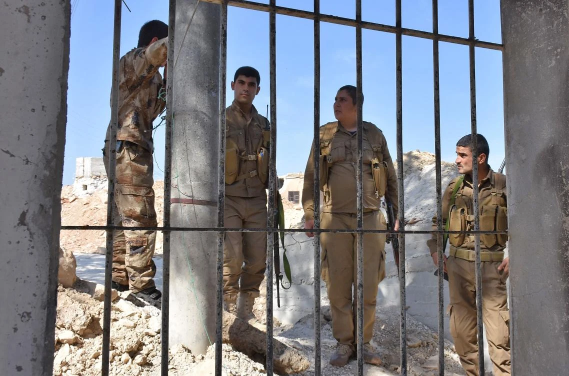 This file photo taken on June 9, 2017 shows Fighters from the Kurdish People's Protection Units (YPG) monitoring in the area of Afrin, along Syria's northern border with Turkey. (AFP)