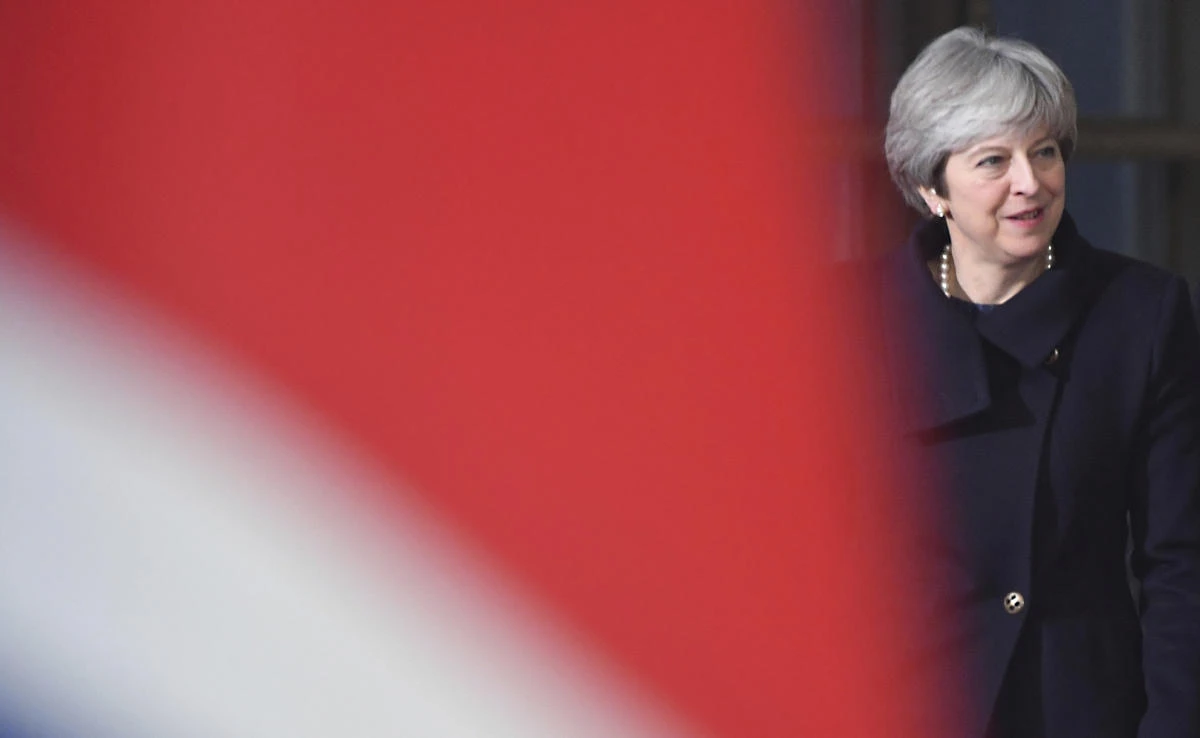 British Prime Minister Theresa May walks by the British flag during an EU summit at the Europa building in Brussels last week. (AP)