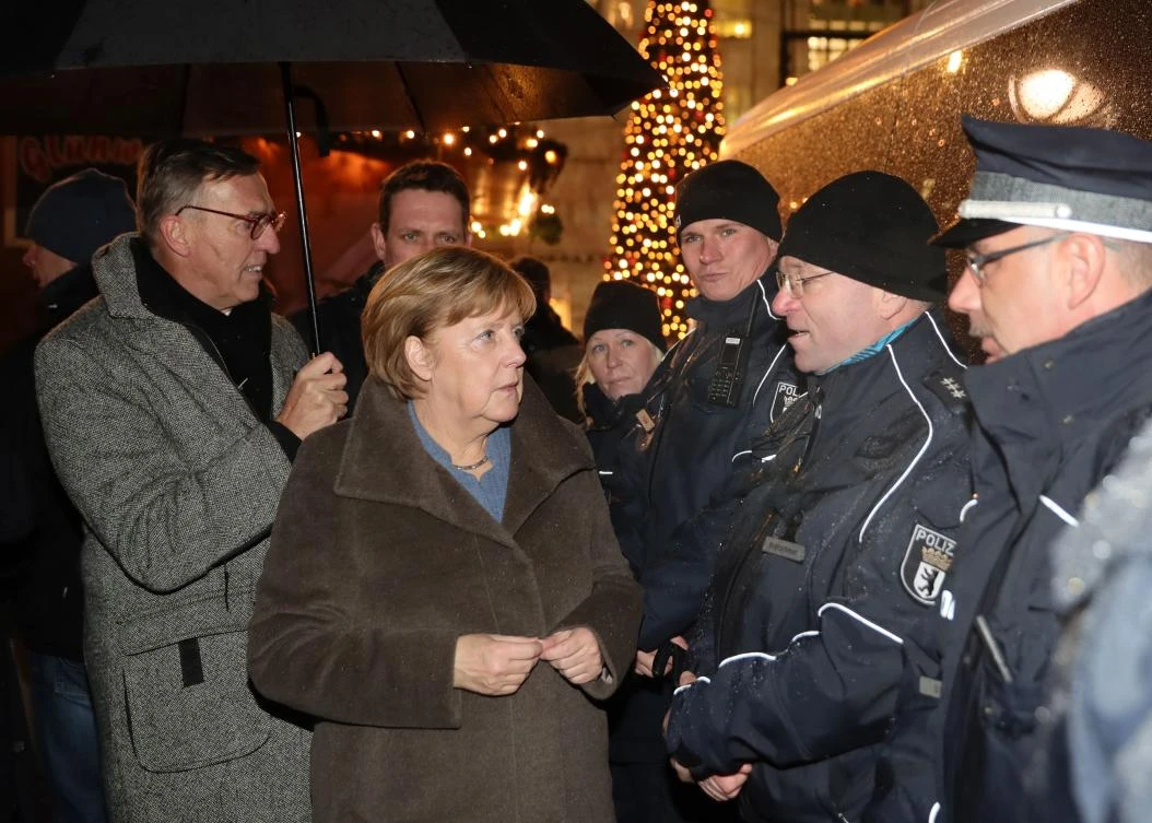 German Chancellor Angela Merkel visits the Christmas market at Breitscheidplatz in western Berlin’s main shopping district on December 12, 2017. (AFP)