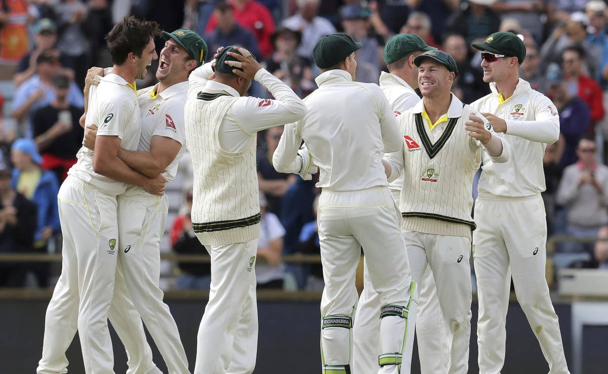 Australian players celebrate winning their Ashes cricket test match against England in Perth, Australia, Monday, Dec. 18, 2017. (AP)