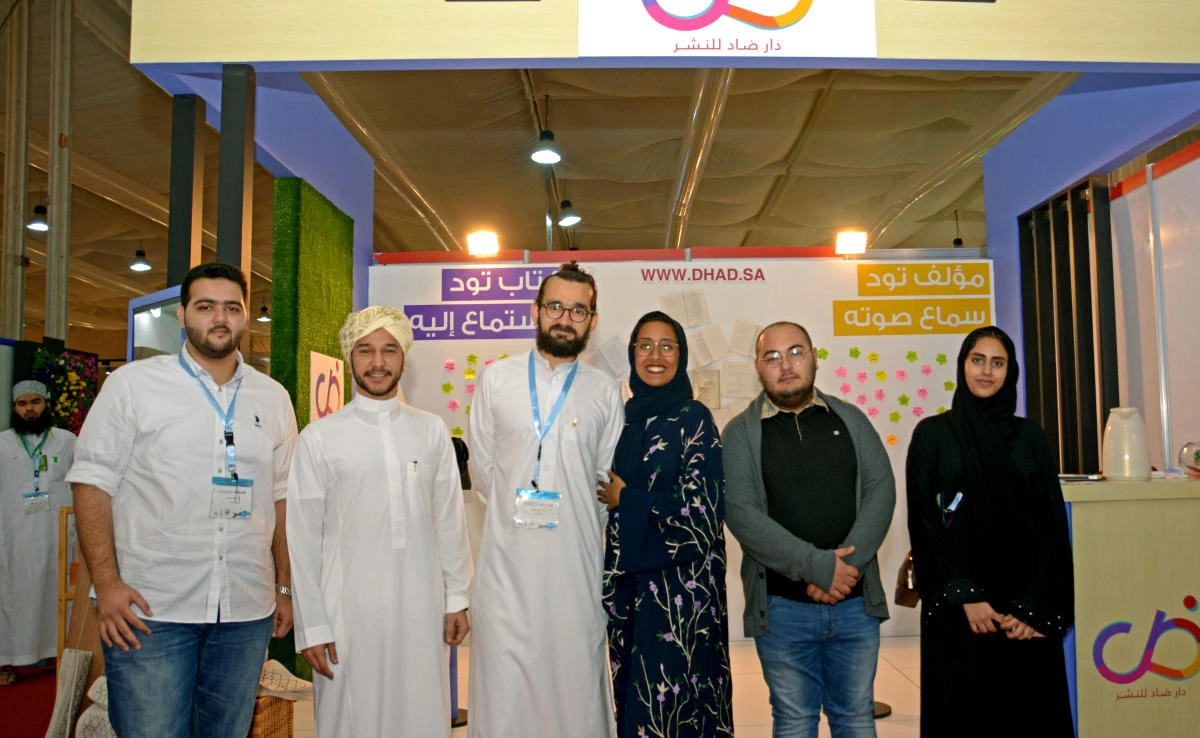 Dhad Executive Director Manar Saud Alomayri (third from right) with her team at the Jeddah Book Fair. (AN photo by Huda Bashatah)