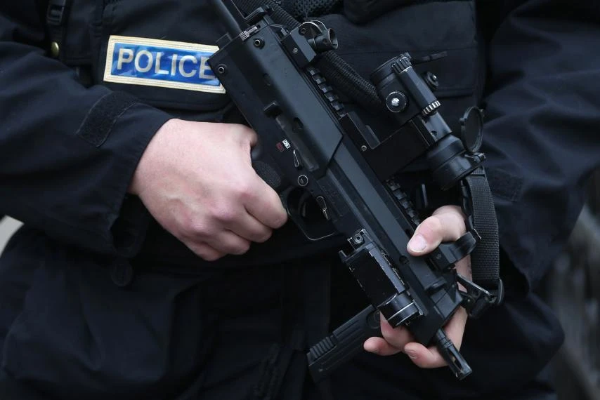 An armed police officer on duty in London, January 2. (REUTERS)
